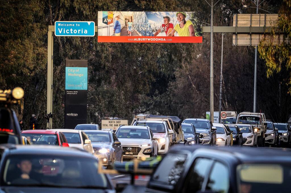 A bottleneck forms at the NSW/Victoria border after the announcement the border would be closed from midnight on July 8. Picture: Getty Images