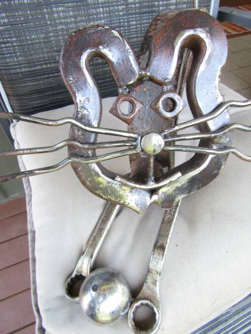 Metal feline companion made from old tools, nuts and bolts.