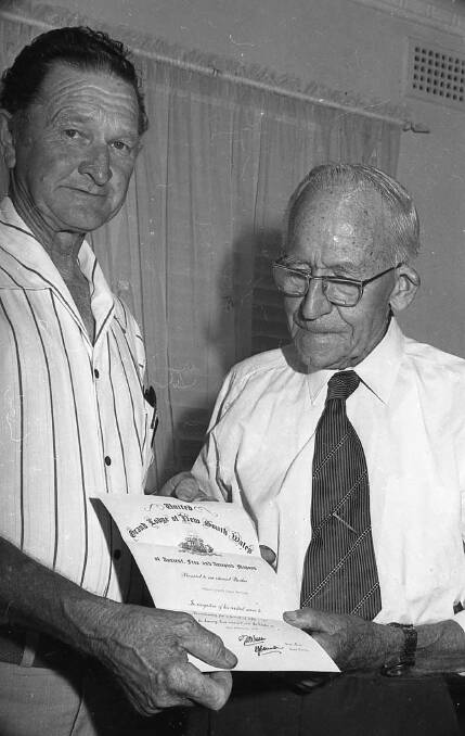 Edgar Marceau (right) presented with a certificate for 50 years service in the Masonic Lodge in 1979 (Photo: Macleay Argus)