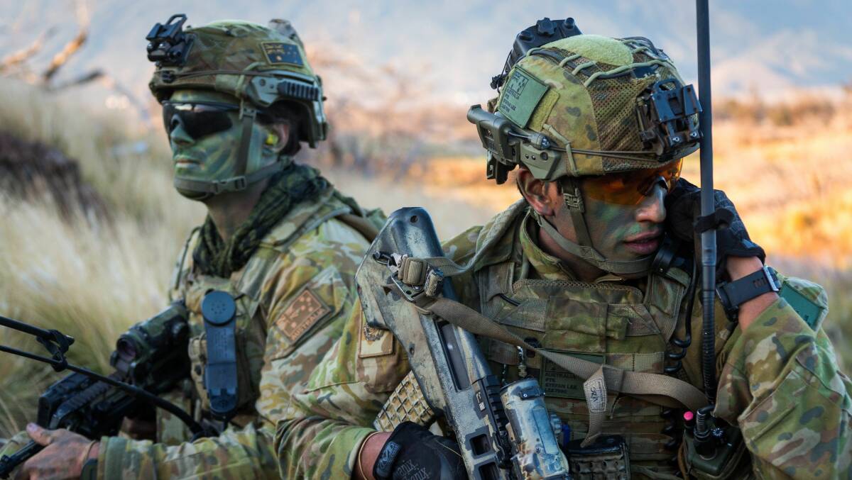 Australian Army soldiers Private Stefan Lee and Lieutenant Robert Loftus from the 2nd Battalion (Amphibious), Royal Australian Regiment, coordinate a platoon during an attack at Pohakuloa Training Area, Hawaii,  as part of Exercise Rim of the Pacific 18 (RIMPAC 18) Photo courtesy of the ADF.