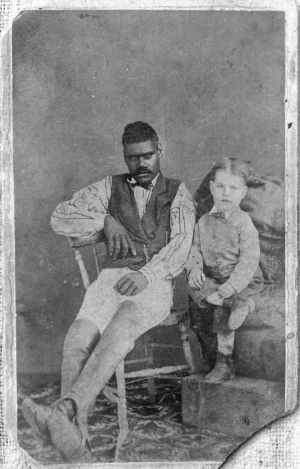 Unidentified True Australians cricketer with one of the Hart children. Photo: Macleay River Historical Society, Angus McNeil Collection
