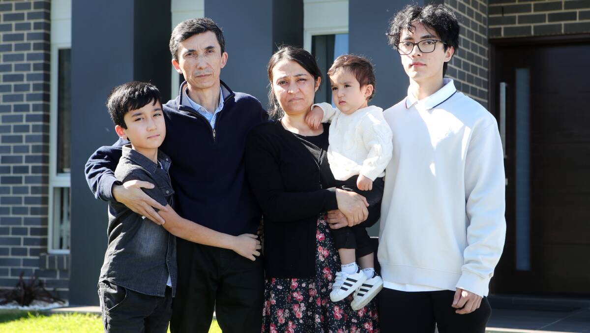 FAMILY'S PAIN: Nabi Zaher and his wife Hassina with three of their four children, Farahmand, Faryar and Fahim. Sylvia Liber.