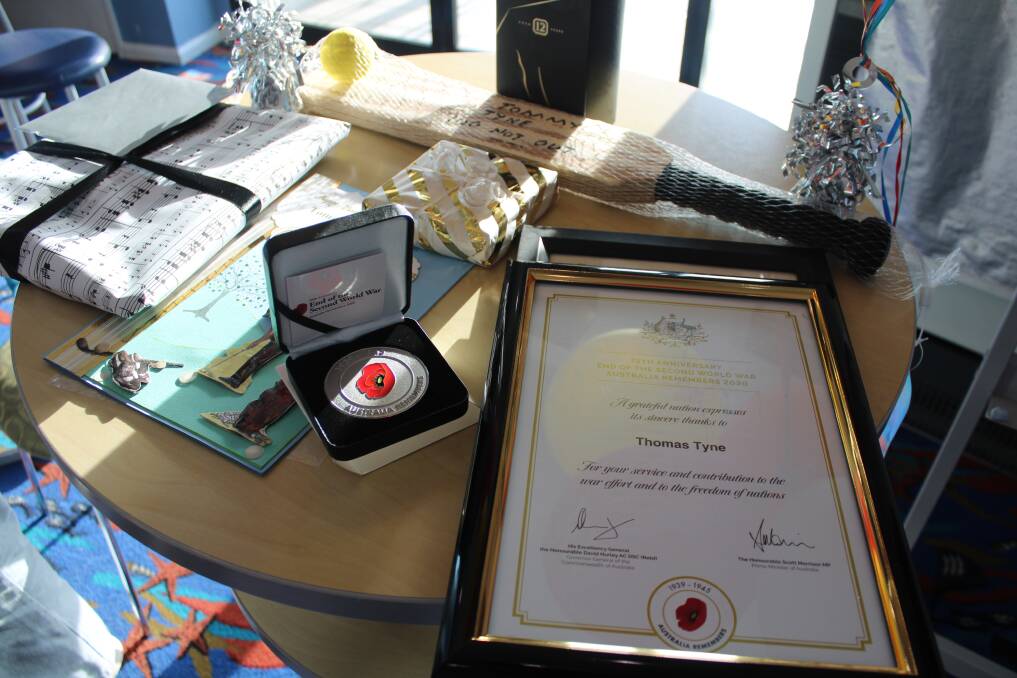 Gifts for Tommy and one his war medals. Photo: Lachlan Harper