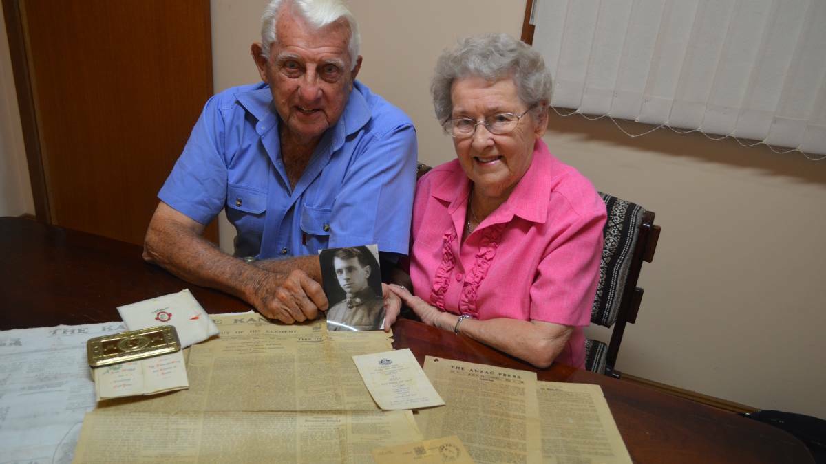 Milton Riggs and his sister Joan Dooley holding a photo of their father Lawrence back in 2015. Photo: File 