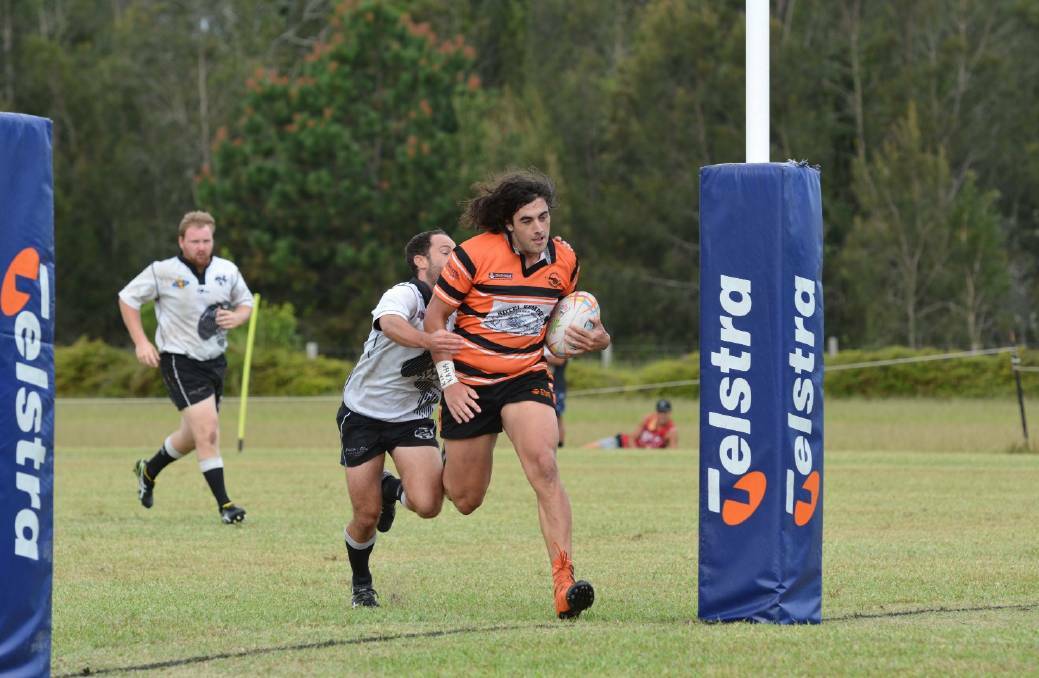 Jordan Byrne playing for the Cannonballs in the Crescent Head sevens tournament in 2017. Byrne is one of several Kempsey players playing in the Lower Mid North Coast Rugby Union competition this year. Photo: File