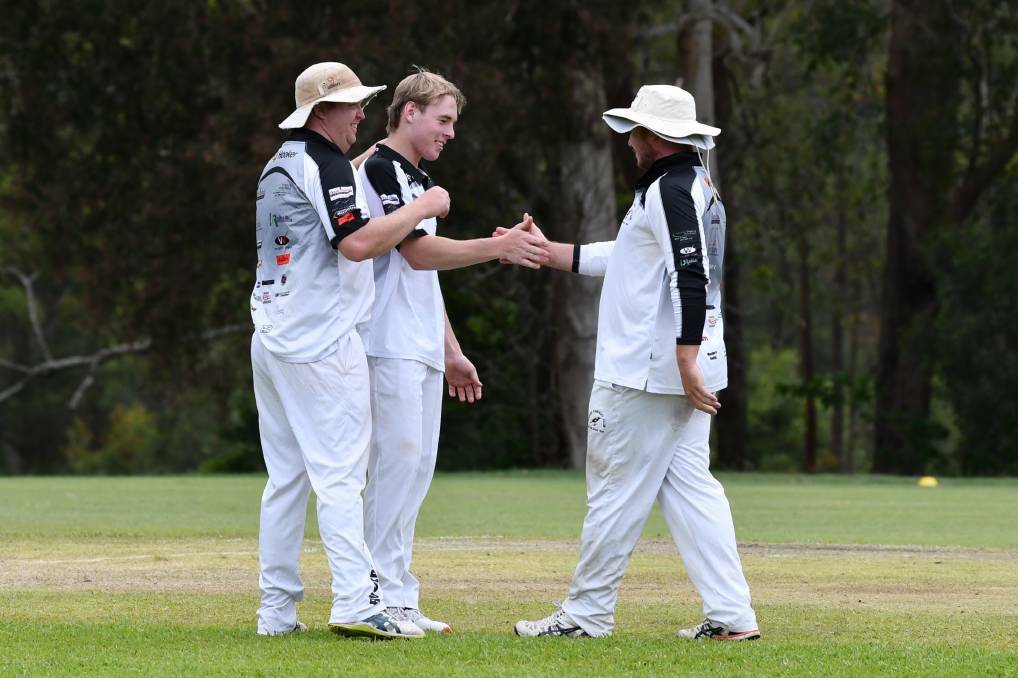 Lachie Dowling celebrates a wicket with Ethan Dowling and Scott Witchard.