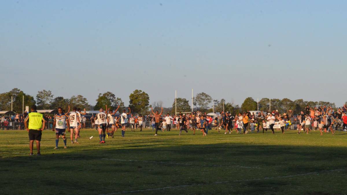 Macleay Valley Mustangs supporters swarm the field after last years win. Photo: File