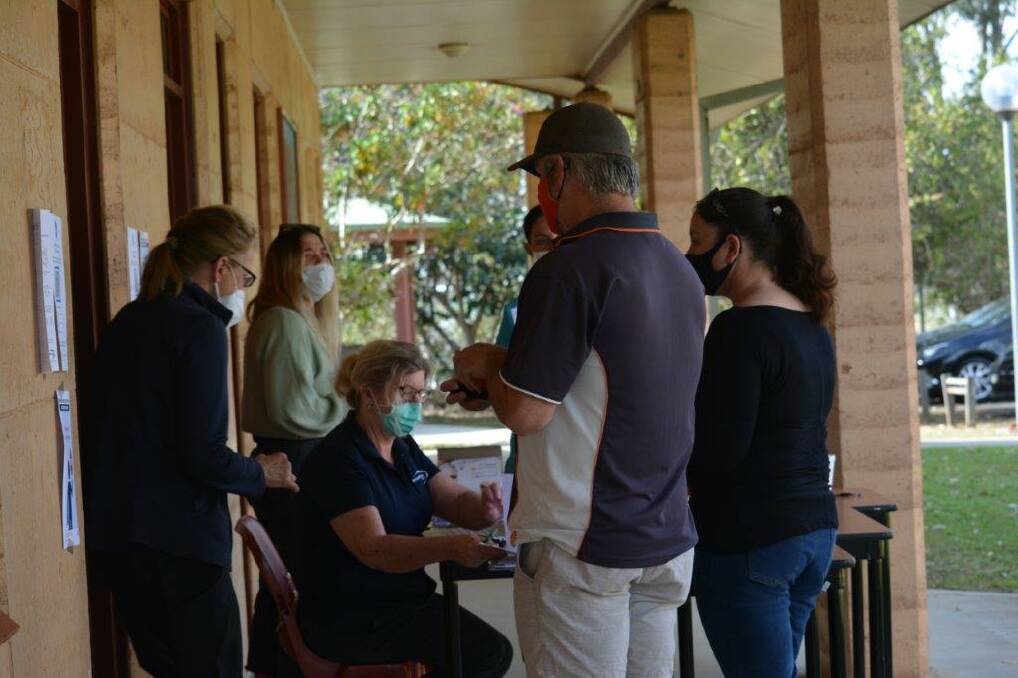 Staff preparing for their jab at the Booroongen Djugun vaccination hub for residential aged care workers. Photo: Healthy North Coast 