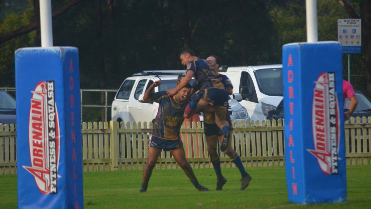 Tim Bull celebrates his debut try against Wingham at Laurieton. 