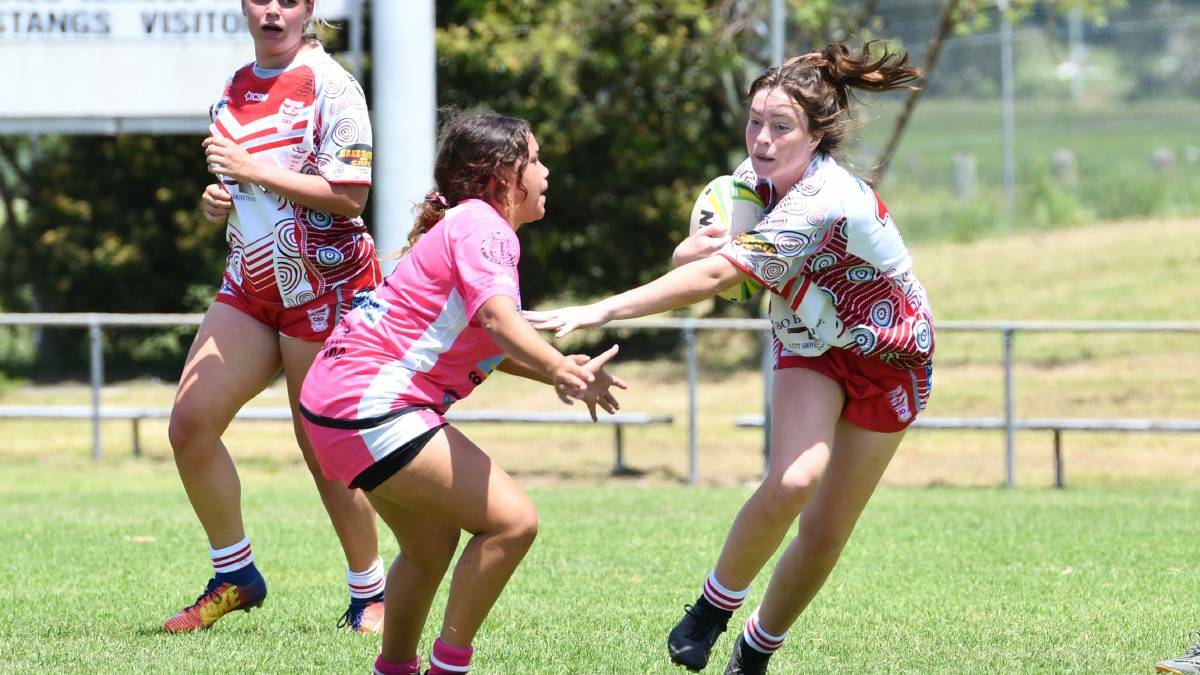A Macleay Valley player looks to evade the opposition in the North Coast 11s. Photo: File 