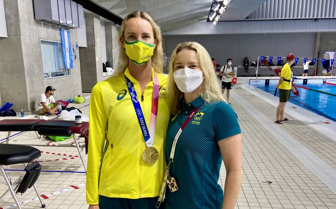 Thea Dillon (right) with Emma McKeon after her 100m freestyle win. Photo: Supplied 