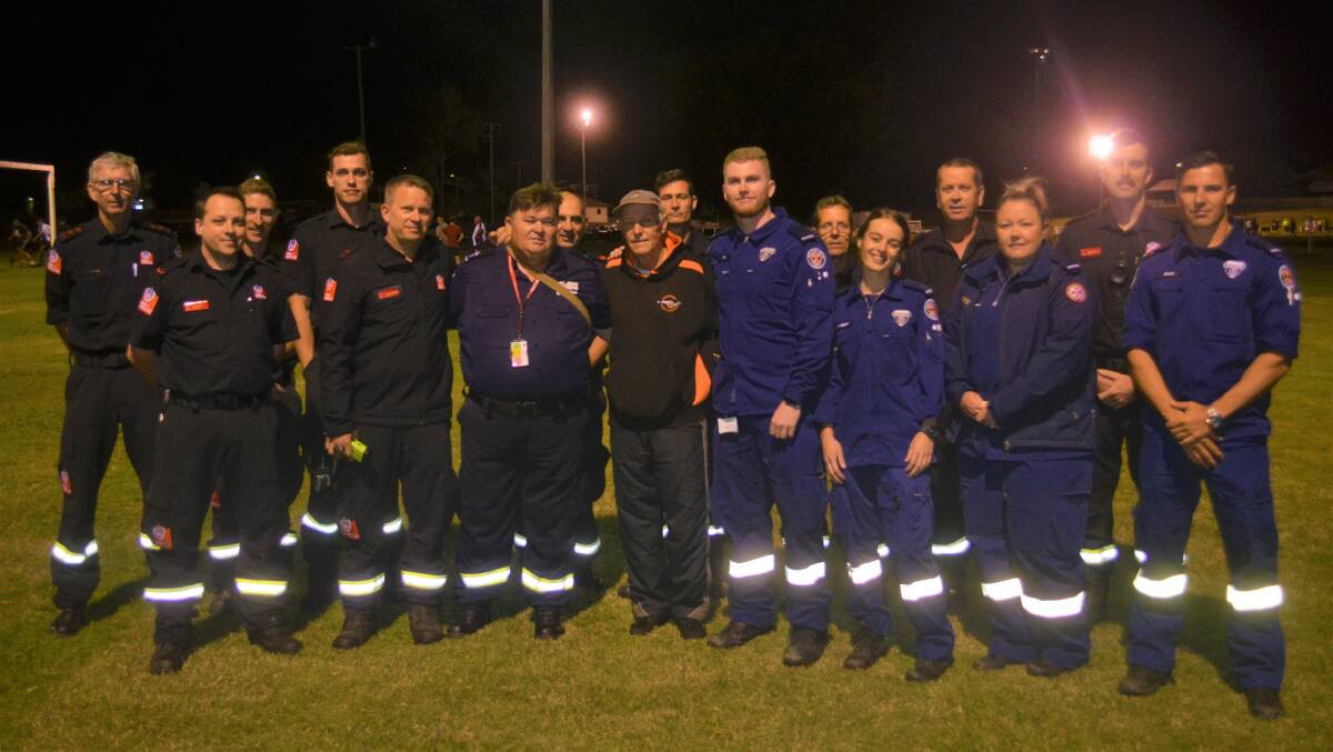 Allan Nugent with members of NSW Fire and Rescue and NSW Ambulance. Photo: Lachlan Harper 