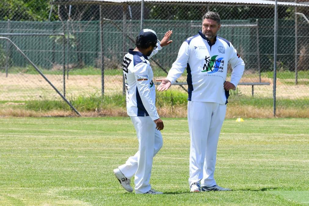 Rusiru Thakshila congratulates Shane Webber on a wicket last year. Photo: File 