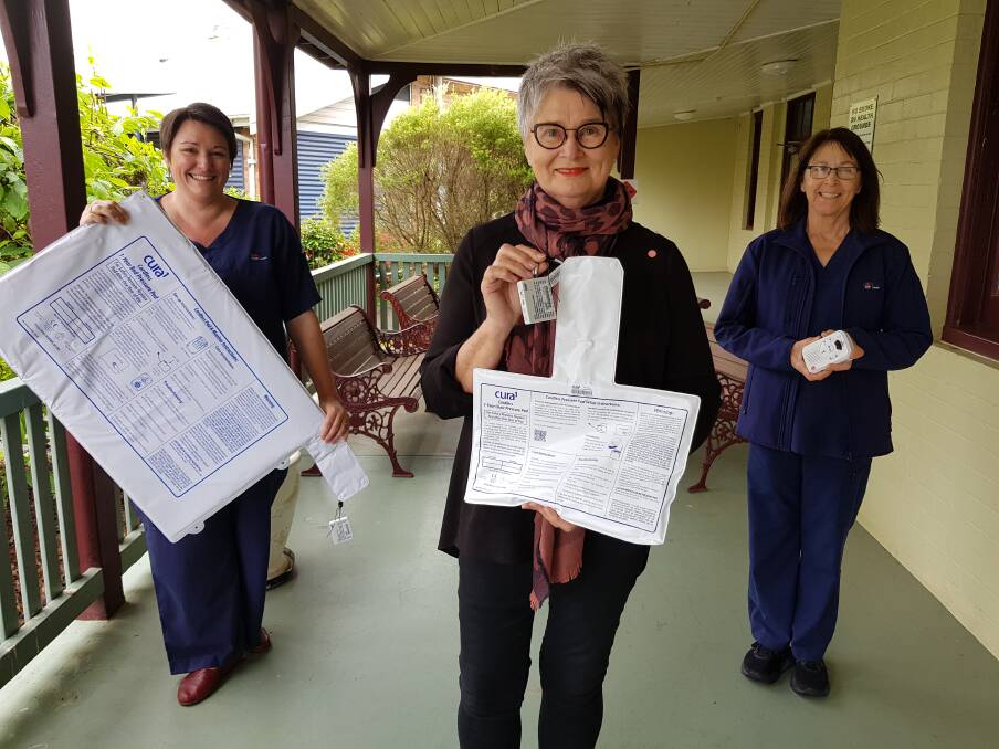 Palliative Care Clinical Nurse Specialist Joanne Pierce with Lilli Pilli Ladies Judy Saul and Michelle Wilcox, who also is a Palliative Care Nurse, and the sensor mats that help to keep patients safe. Photo: Supplied