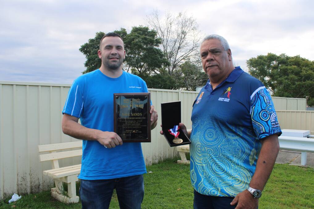 Chad Ritchie and Phillip Dotti hold Dave Sands plaque and medal honouring his induction into the International Boxing Hall of Fame. Photo: Lachlan Harper