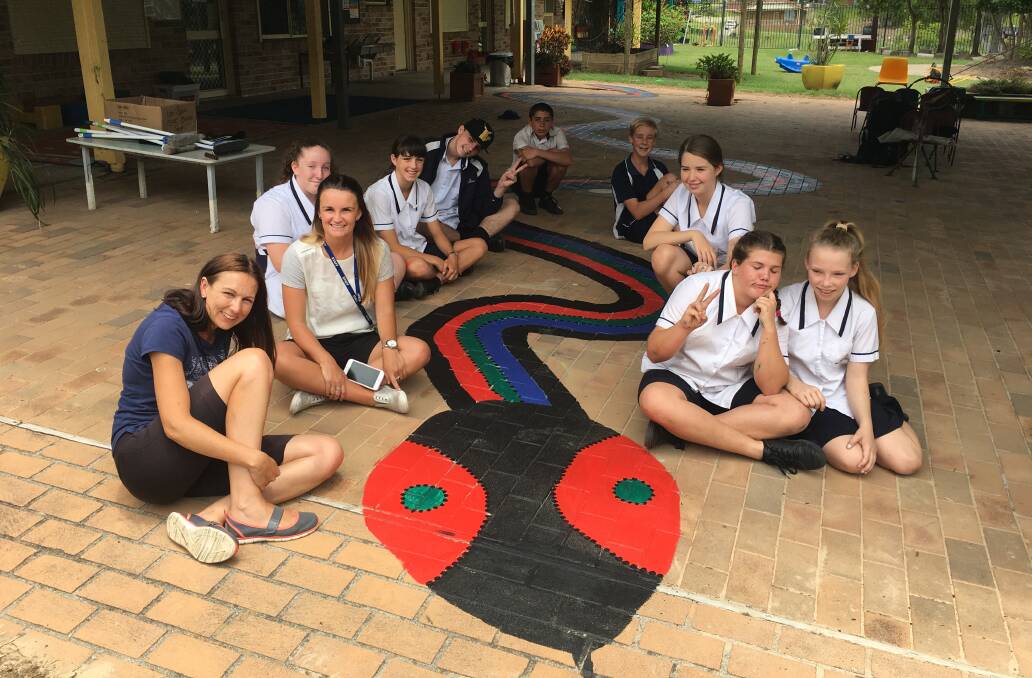 Students helped to re-paint a mural at the Dalaigur pre-school,