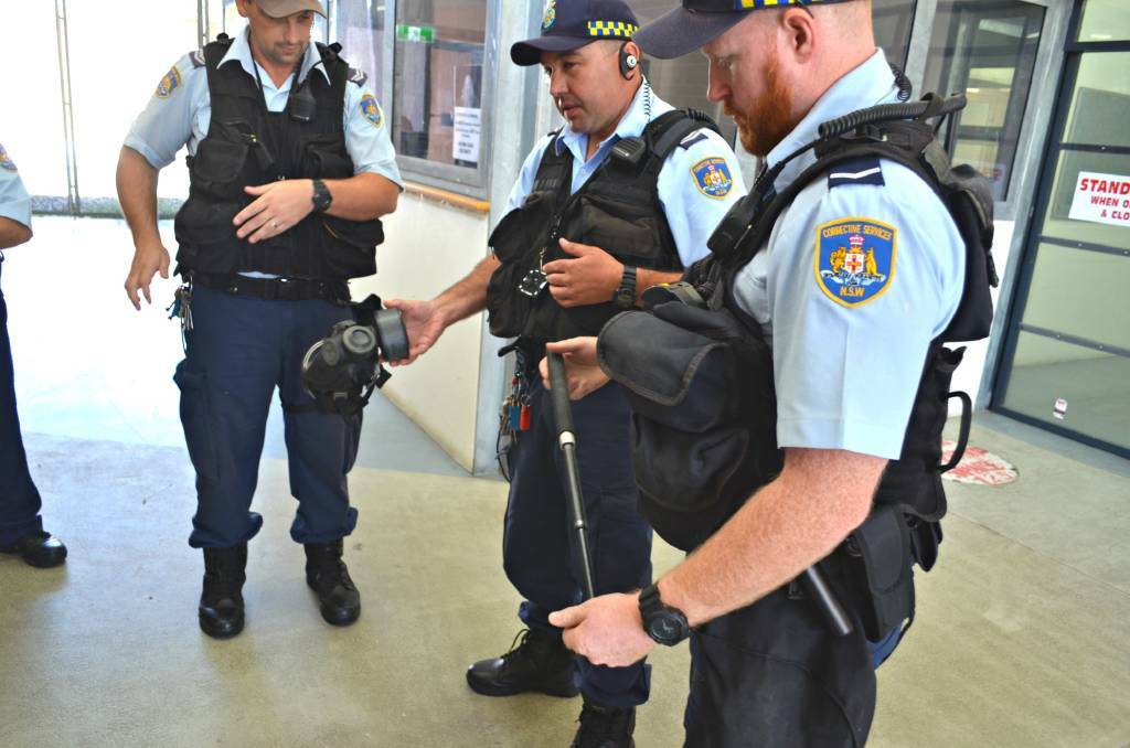 As part of a media tour for National Corrections Day, first response officers talk through the various materials they carry to respond to any violent situations such as crowd dispersal gas and batons.

