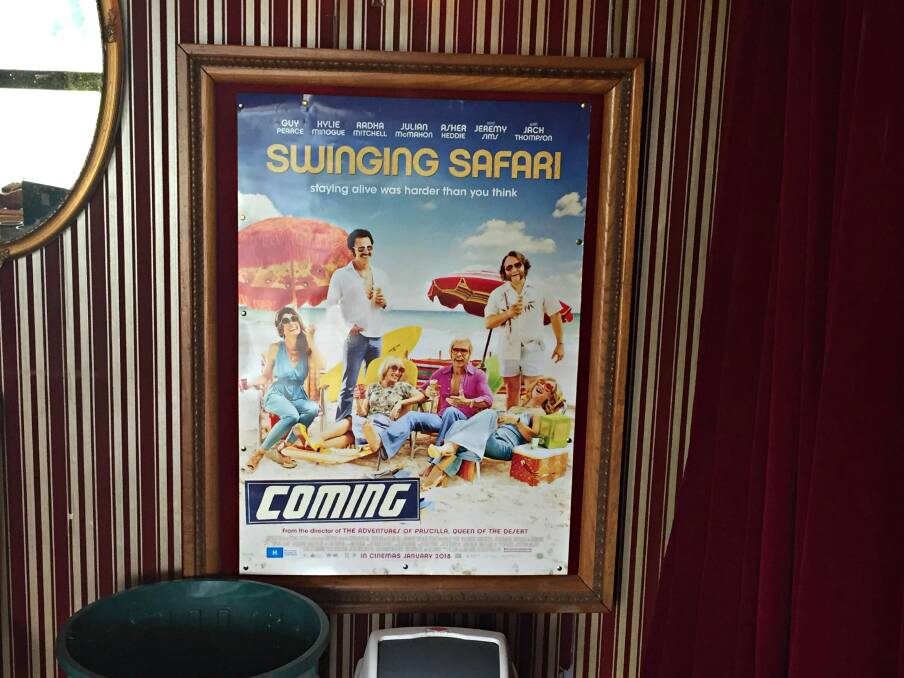 One of the movie boards on the walls of the Bandbox Cinema.