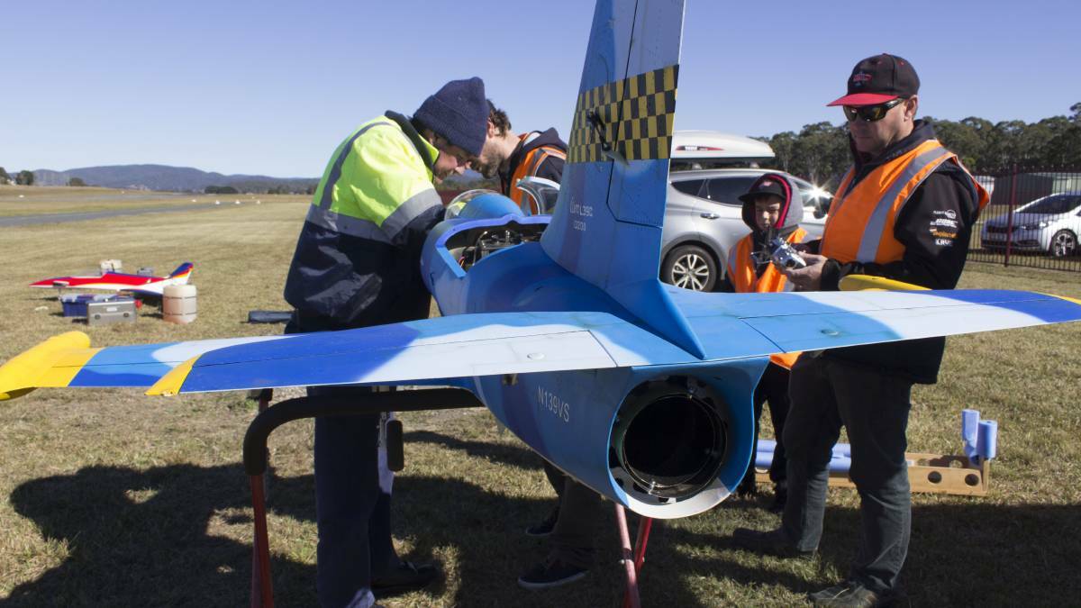 Pilots work on one of the model jets which featured in the 2016 show.
