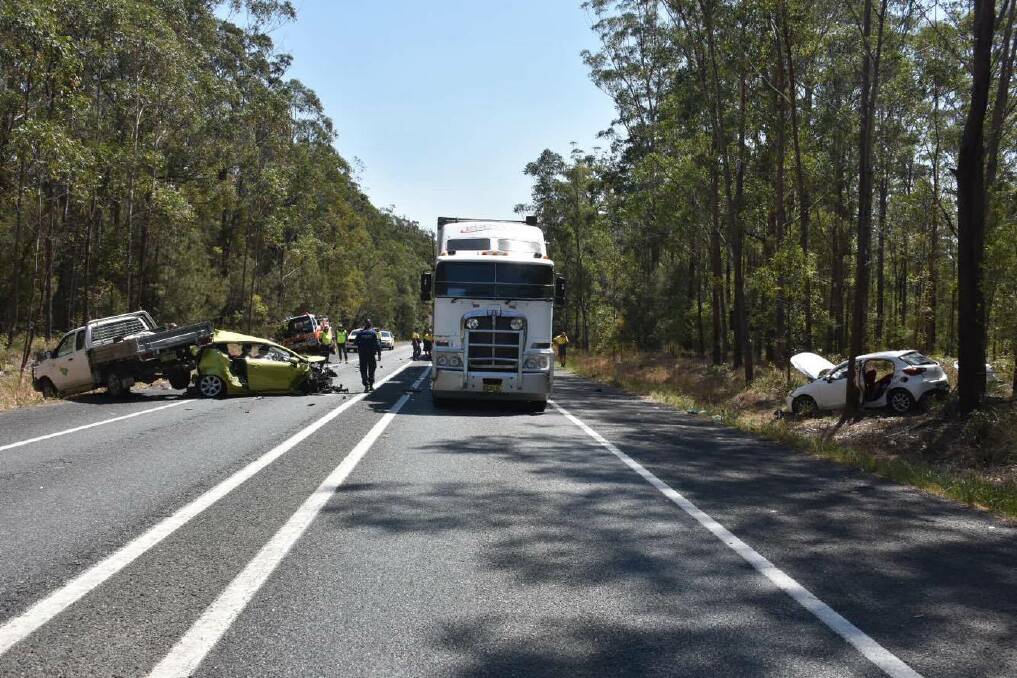 Horror stretch: Emergency services crews on-site at a highway crash where a woman has lost her life. Photo: Ivan Sajko.