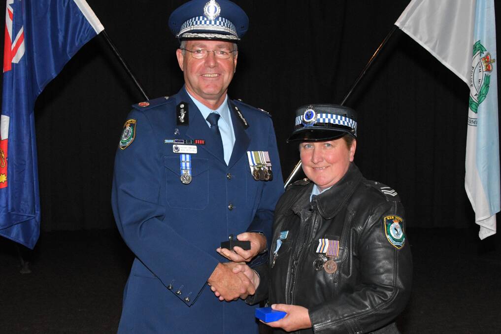 HELPING HAND: Assistant Commissioner Northern Regions Max Mitchell and Snr Cst Wendy Hudson who was recognised for her long service to the community.