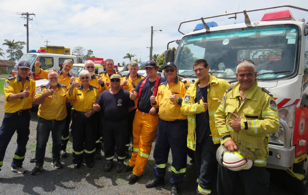 Thumbs up: Macleay firefighters celebrate after returning from the south coast on Monday, February 10. 