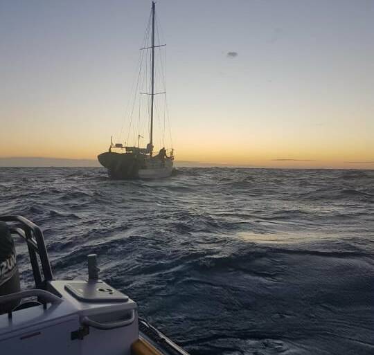 The yacht off South West Rocks was safely towed back to calmer waters with a lone sailor and his dog on board. Photo: Marine Rescue NSW