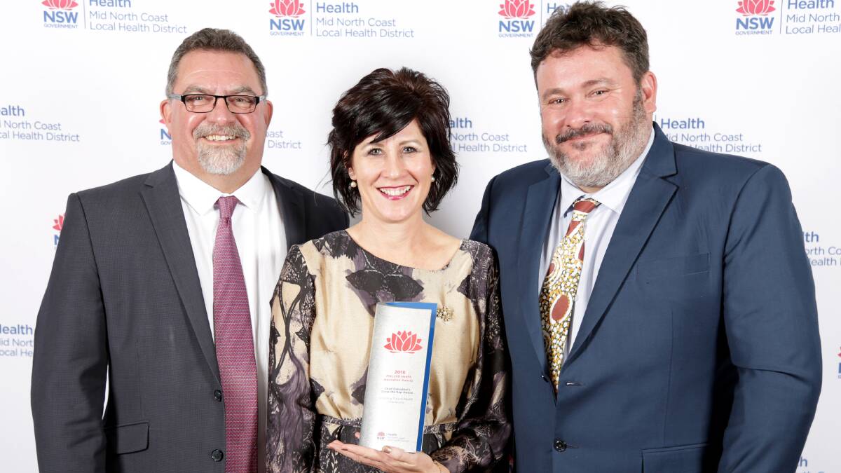 Australian Indigenous Doctors’ Association CEO Craig Dukes, MNCLHD Bowraville Project Officer Luisa Eckhardt and Bowraville Central School Principal David Taylor with the award