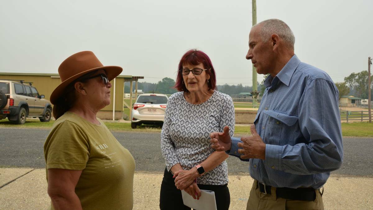 BACK IN NOVEMBER: NSW Recovery Coordinator Euan Fergusan and assistant Ronnie Faggotter talk to Taylors Arm evacuee Jan Roberton