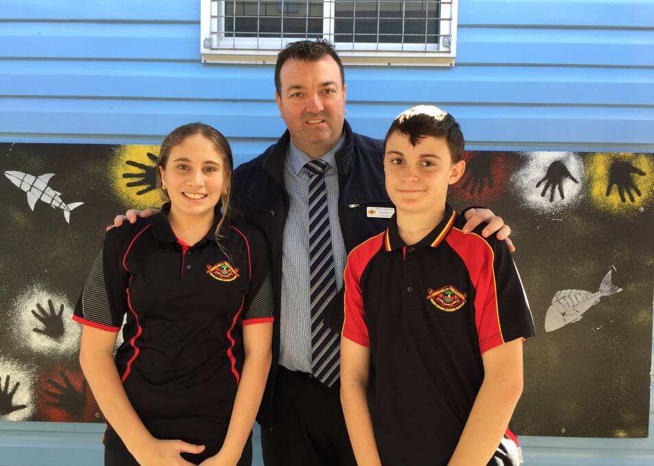 Principal Paul Byrne and school captains Isabella Bates and Andrew Nicholas.