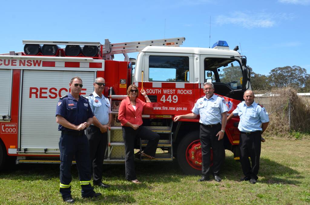 Melinda Pavey and Fire and Rescue NSW Regional North Area Commander Chief Superintendent Gary McKinnon with South West Rocks Fire and Rescue crew. Photo: Ruby Pascoe