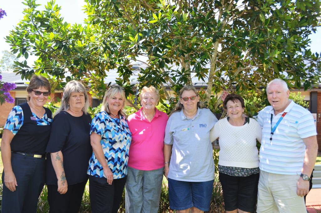 Sidonie Davies with staff and residents at Bupa Aged Care. Photo: Ruby Pascoe