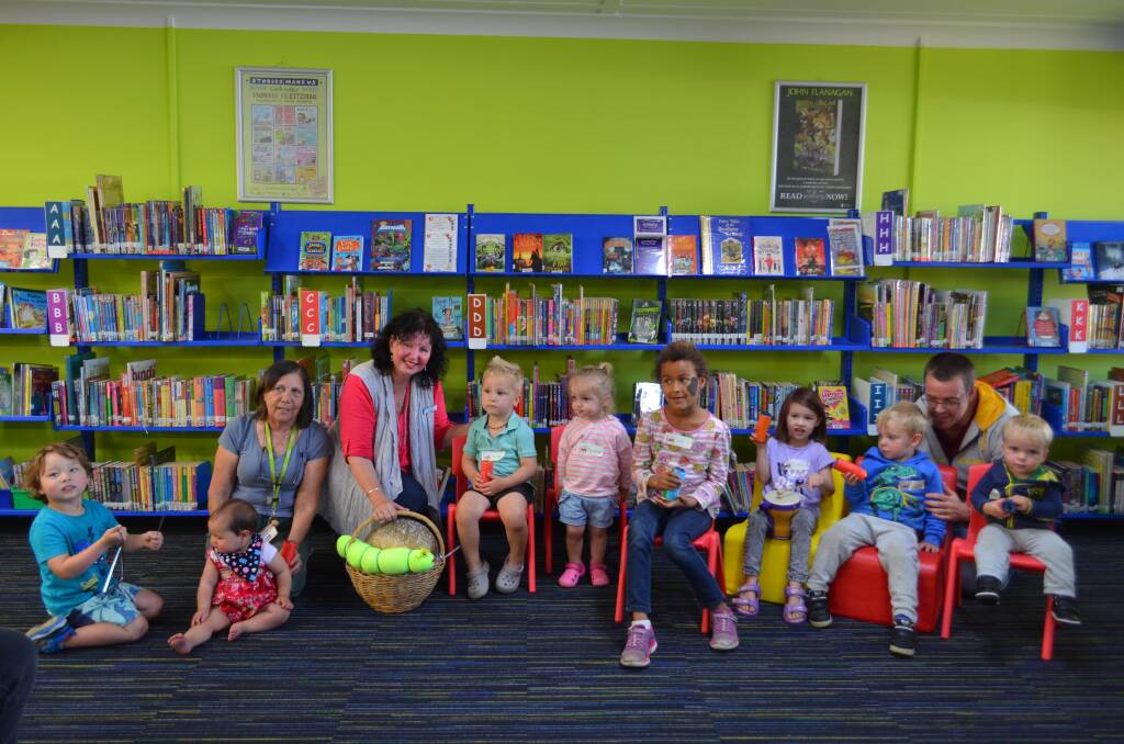 Karen Hall and Ruth Waite with children helping the egg to grow at Kempsey Shire Library today