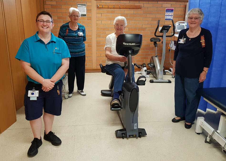 Physiotherapist Siobhan Finnegan with Kempsey UHA and Pink Ladies volunteers Ruth Woodward, President Aileen Lewthwaite and Pat Major with the recumbent bike. Photo: Supplied