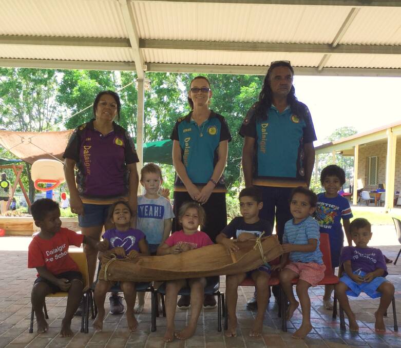 Students and staff from Dalaigur Preschool with one of the canoe's made for the artwork
