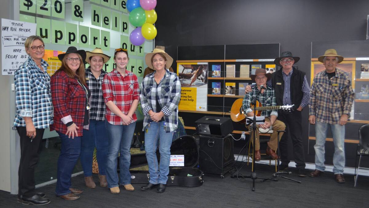 Commonwealth Bank staff and busker Trevor Riley
