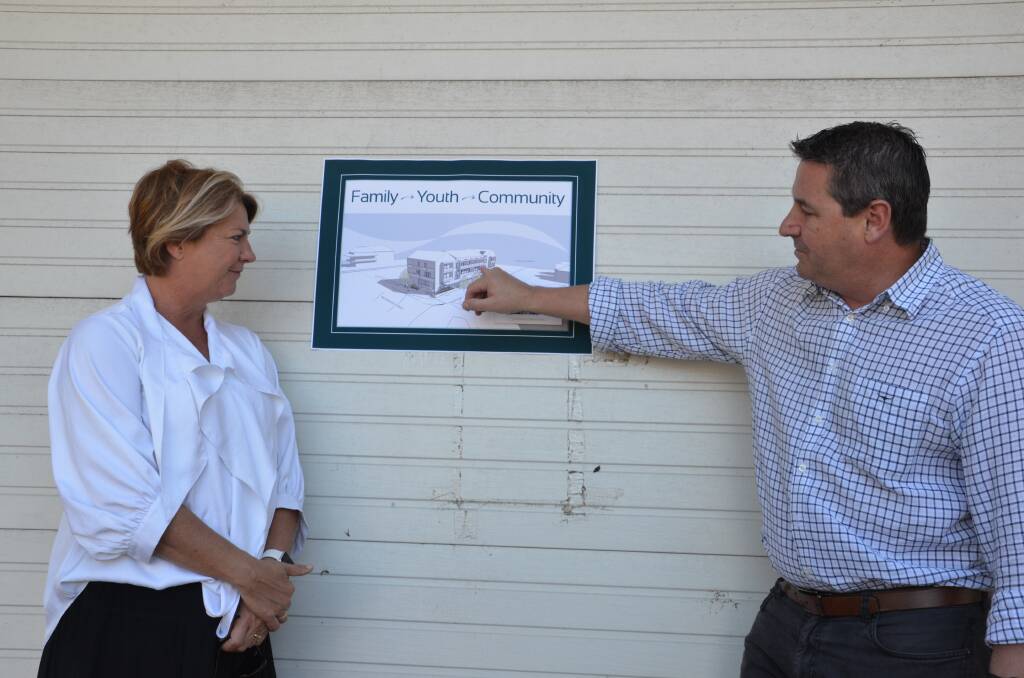 Federal Member for Cowper Pat Conaghan and State Member for Oxley Melinda Pavey look over designs for the centre. Photo: Ruby Pascoe