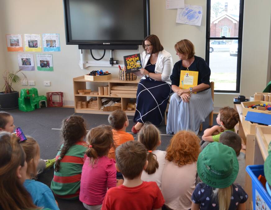 Minister for Early Childhood Education Sarah Mitchell and member for Oxley Melinda Pavey read to children at Little Adventures Early Learning
