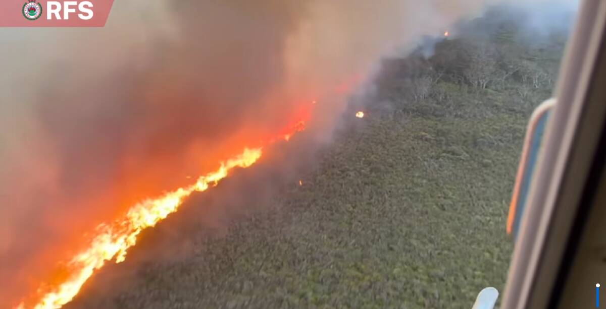 The McGuires Crossing Rd Fire may reach Hat Head Rd later this evening, cutting off access to the town. Picture, NSW RFS