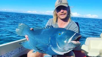 Angler Kayne with a blue groper. Picture supplied