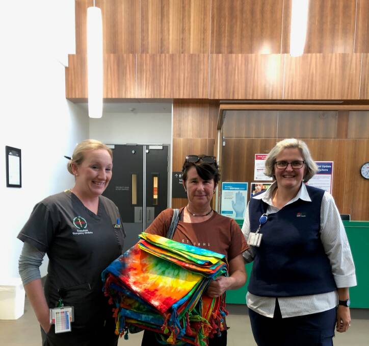 Kempsey District Hospital Acting Director of Emergency Dr Dawn Martin, founder of Baylins Gift Hayley Hoskins and Nurse Manager Katie Croad with the tie-dyed laundry bags for clinical staff. Photo: Supplied