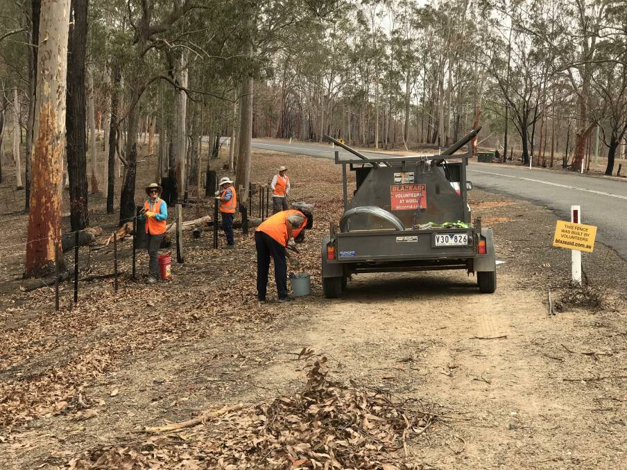 BlazeAid volunteers help restore fences near Willawarrin. Photo: Supplied