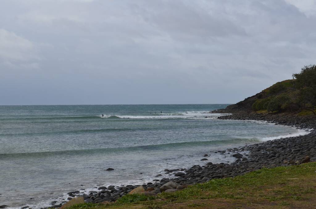 Surfers brave the windy conditions at Crescent Head