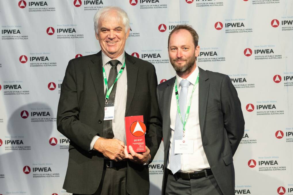Kempsey Shire Council representative, Tony Green, accepts the award for the Crescent Head Foreshore Reserve public amenities building from Australasian IPWEA President, Mat Greskie. Photo: Supplied