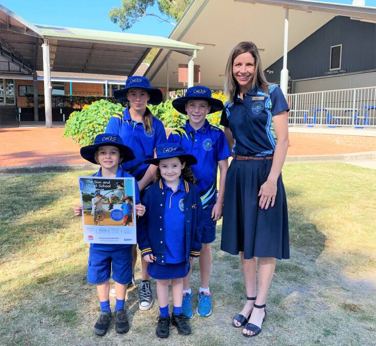 Crescent Head Public School administration manager Renee Marchment with school leaders Alannah Koivu and Chace Bryant and Kindergarten students Lachlan Williams and Sadie Smith. Photo: Supplied