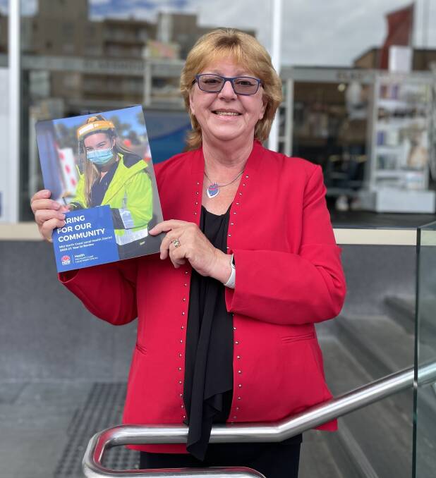 Mid North Coast Local Health District Governing Board chair Professor Heather Cavanagh, who displays the Caring for our Community Booklet, acknowledges the dedication of healthcare teams.