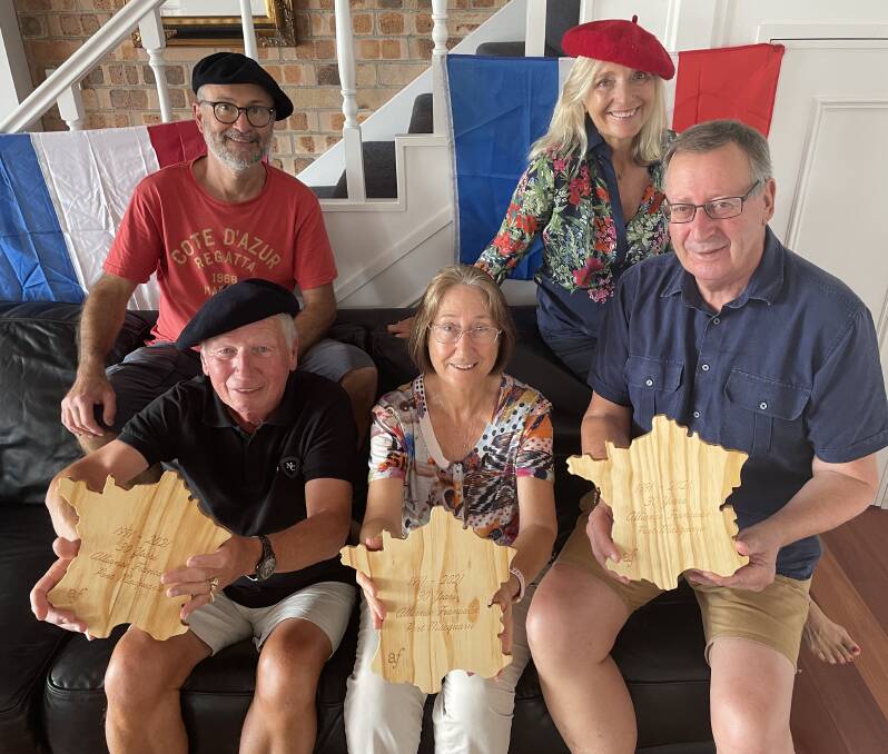 (From back left) Jean-Louis Tostivint, Lynne Jaraczewski, (front) Jean Jaraczewski, Cristina Chonnec and Nic Bryant display the map of France-shaped cheeseboards ahead of the Alliance Francaise Port Macquarie's celebration on Saturday.