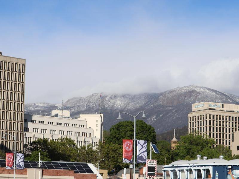 Mt Wellington, also known as Kunanyi, was dusted with snow as the mercury plunged in Hobart.