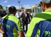 Metricon staff talk with Prime Minister Scott Morrison at a site in Brisbane.