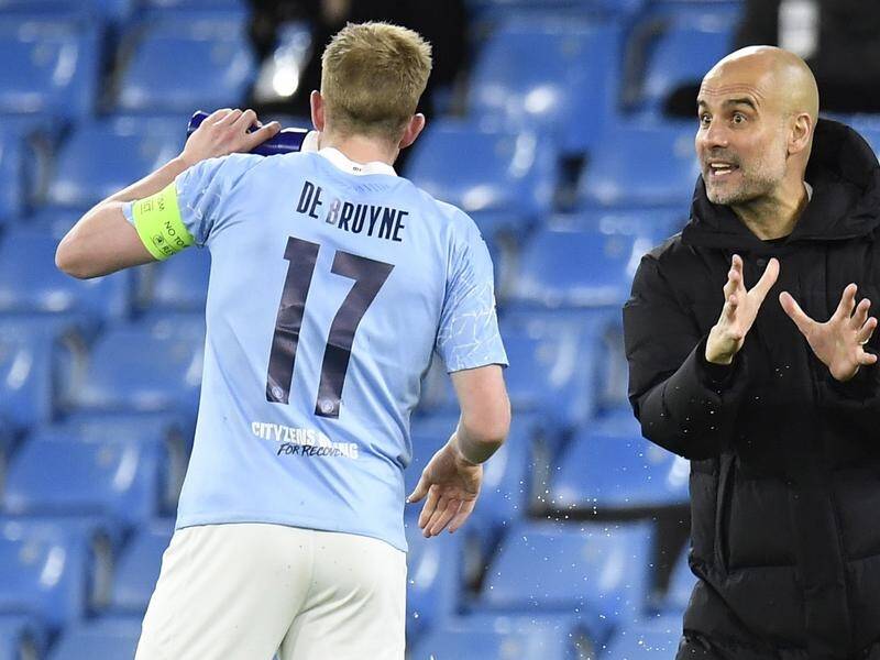 Kevin De Bruyne (l) enjoys working with Pep Guardiola and has signed a two-year contract extension.